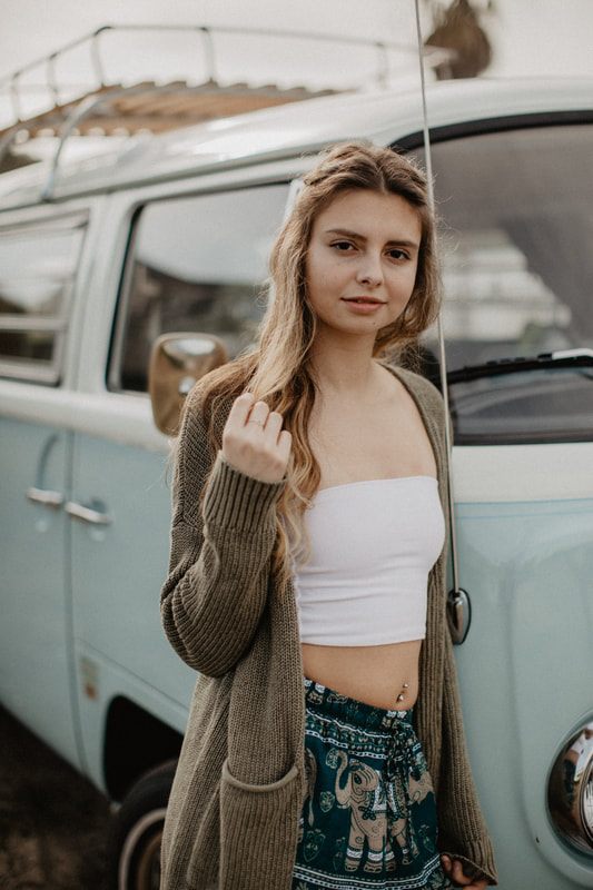 Model posing candidly for The Elephant Temple clothing brand campaign.
