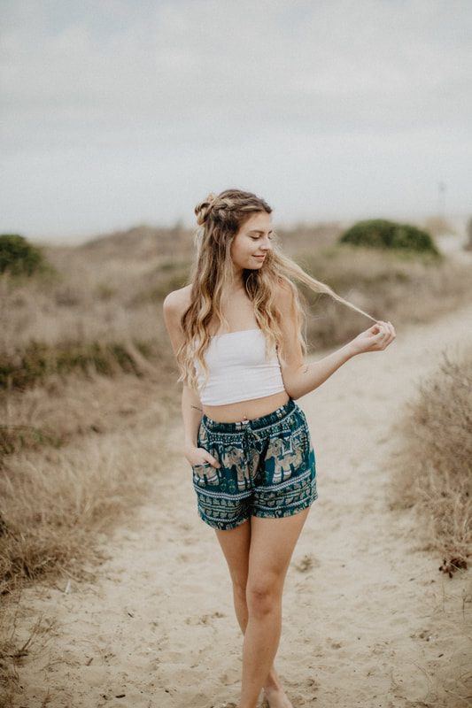 Model wearing The Elephant Pants signature print in an outdoor campaign shoot.