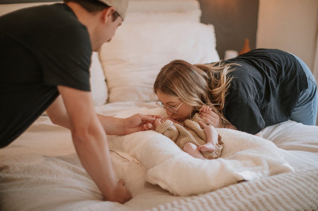 Father holding his newborn daughter in the nursery