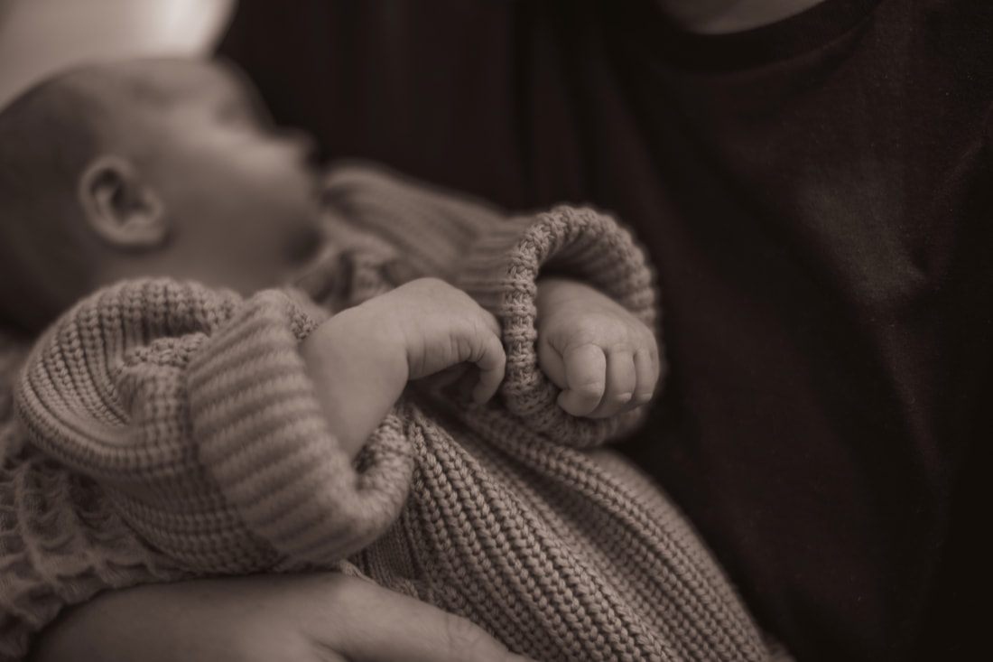 Newborn baby swaddled in a cozy corner of the nursery