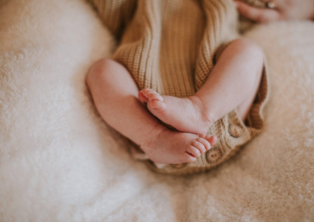 Newborn baby resting peacefully to close out the in-home session