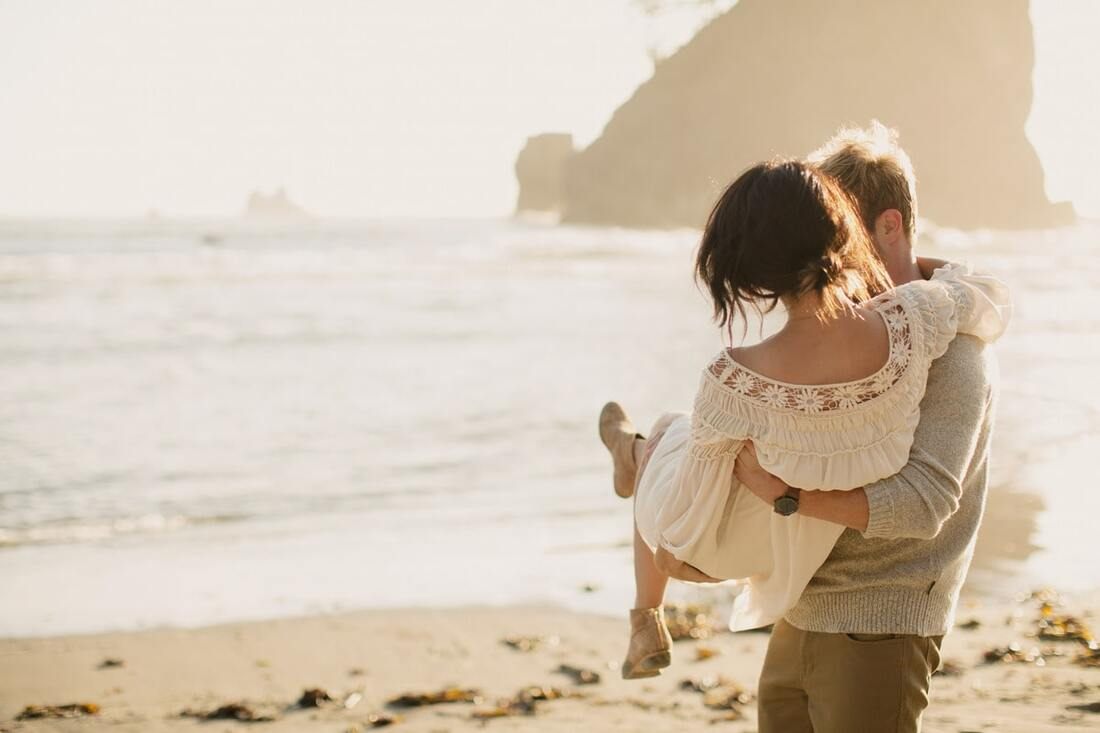 Close embrace between a couple on the beach at La Push