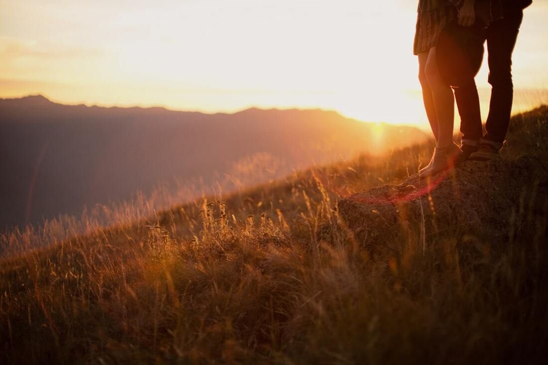 Soft, warm sunset light on a couple at Hurricane Ridge in Olympic National Park
