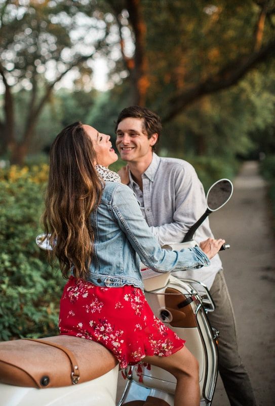 Couple sharing a toast with champagne in the park