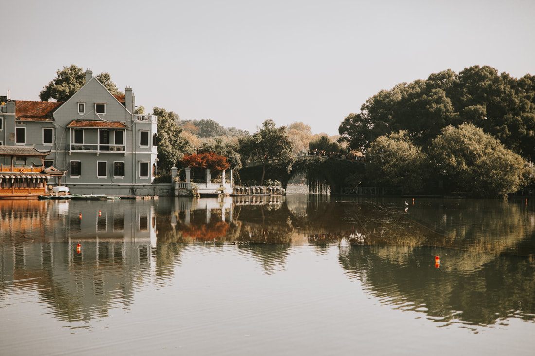 Scenic stone pathway along the West Lake shoreline in Hangzhou