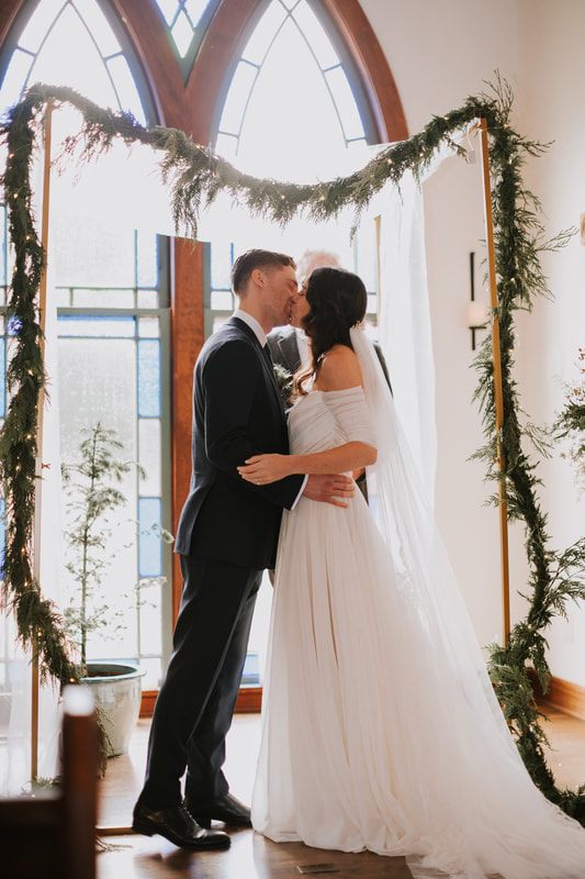 Bride and groom exchanging vows inside the Victorian Valley Chapel