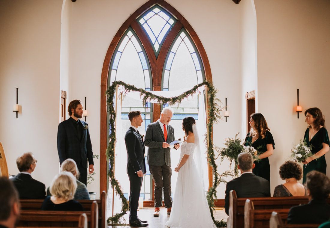 Guests watching the ceremony inside the quaint chapel