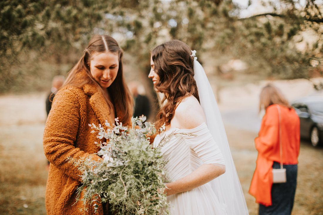 Close-up of the couple holding hands during their vows
