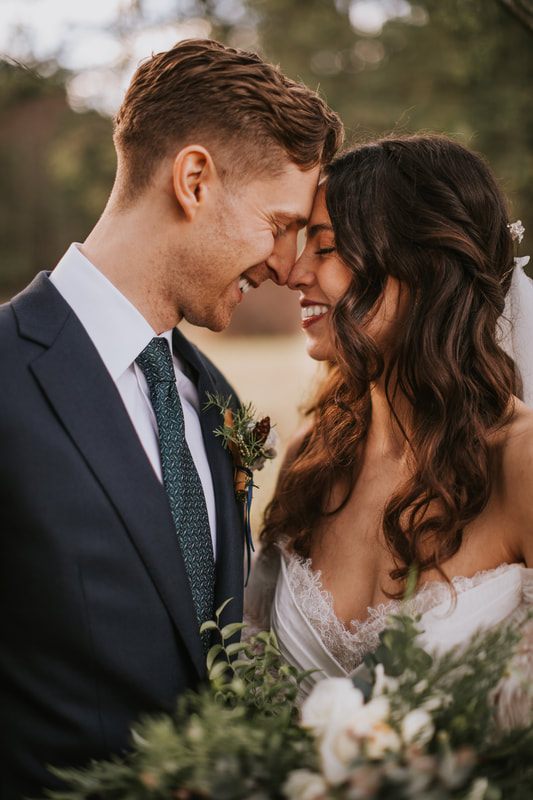 Close-up portrait of the bride and groom after their ceremony