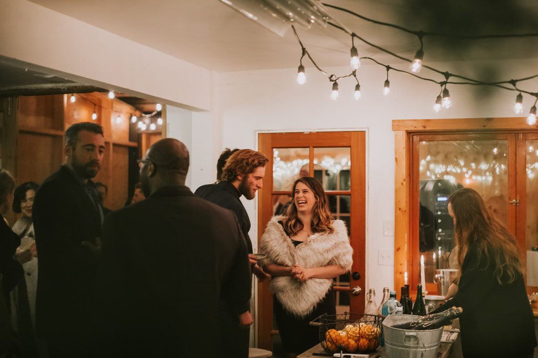 Bride and groom sharing a toast at their reception dinner