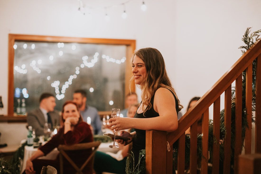 Bride and groom sharing a toast at their reception dinner