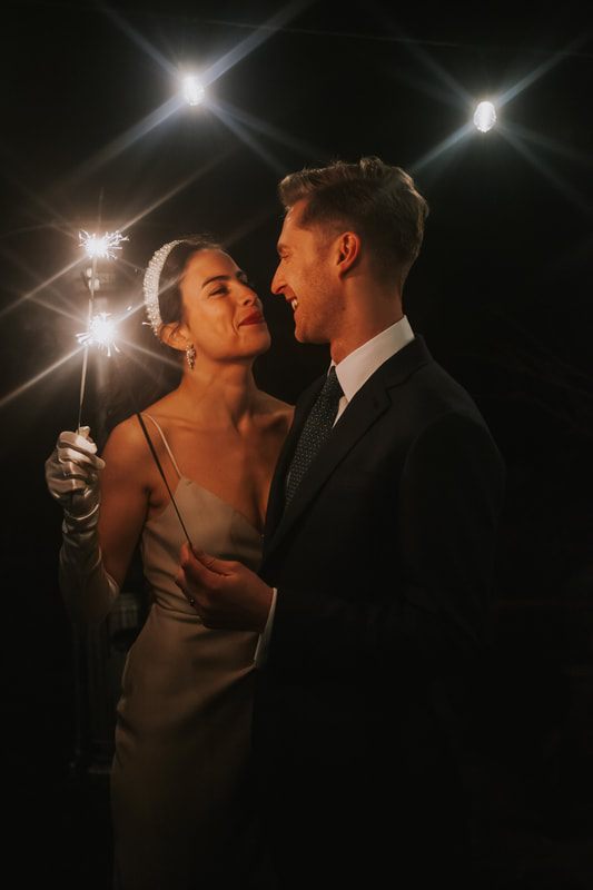 Bride and groom sharing a toast at their reception dinner