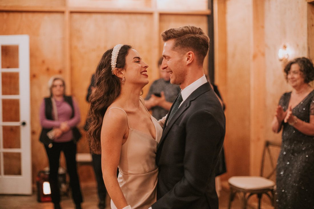 Newlyweds dancing together as midnight approaches on New Year's Eve