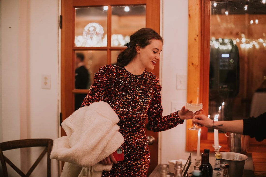 Guests enjoying hot apple cider and shortbread before the reception