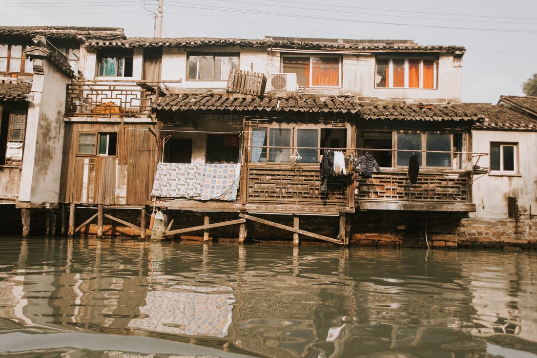 A quiet canal view in Suzhou, China during a boat tour of the city