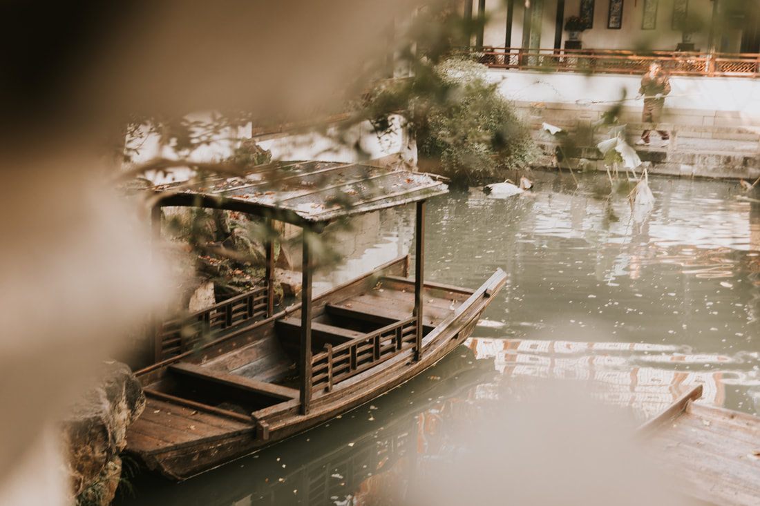 A quiet canal view in Suzhou, China during a boat tour of the city