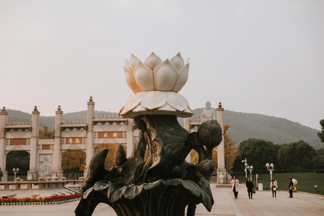 Visitors exploring the grounds surrounding the Lingshan Grand Buddha