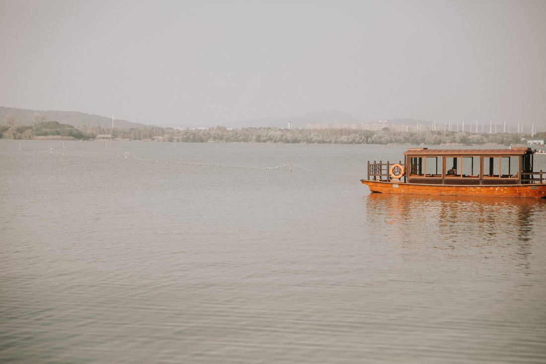 Locals strolling along the Lake Lihu waterfront