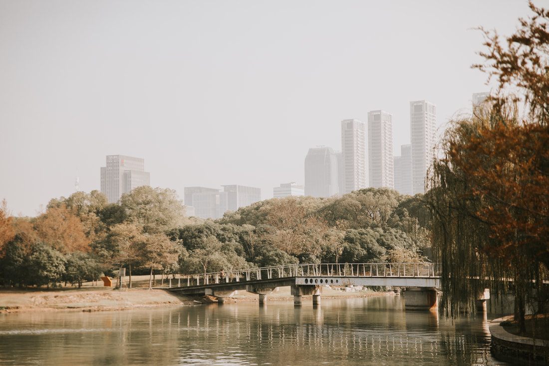 Wuxi cityscape reflected in the still waters of Lake Taihu