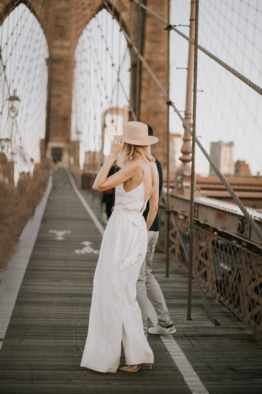 Valentina walking through Brooklyn in a non-traditional bridal look