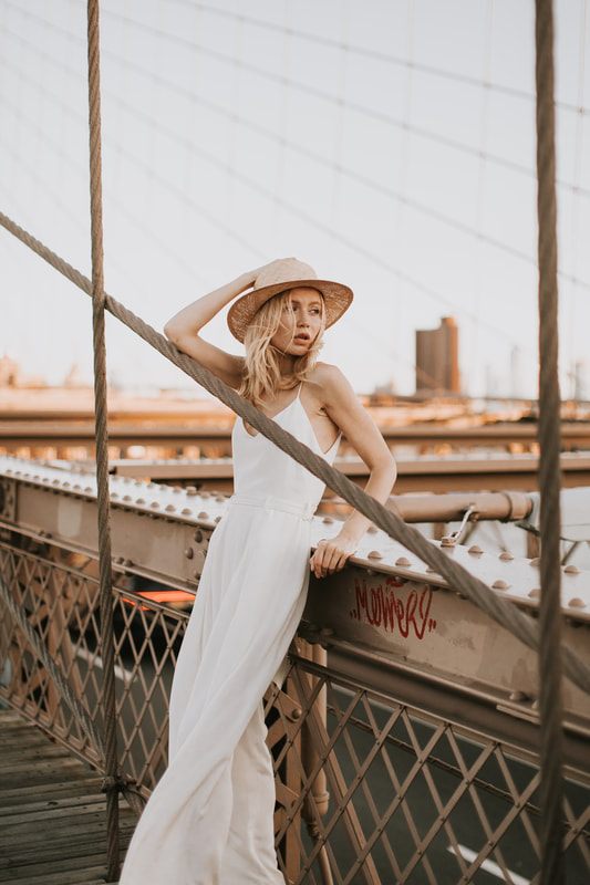 Full-length portrait of Valentina showcasing her bridal romper in NYC