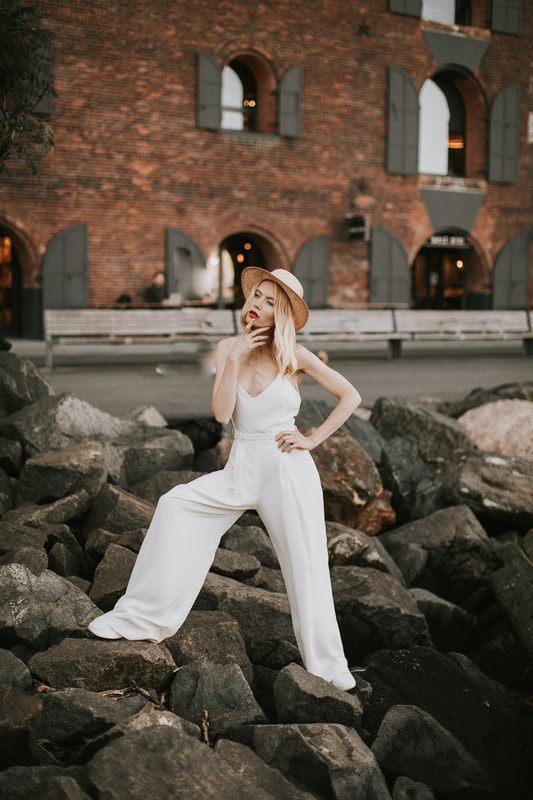 Full-length portrait of Valentina showcasing her bridal romper in NYC