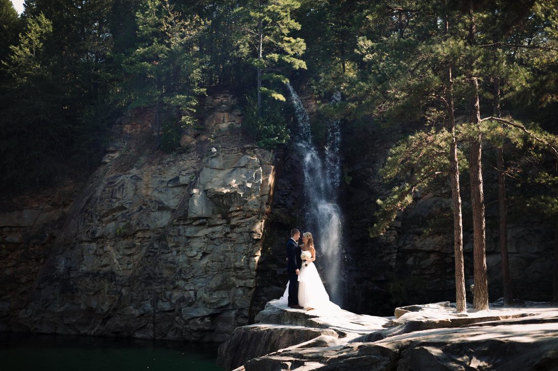 Groom and bride sharing a quiet moment in the woods near Charlotte