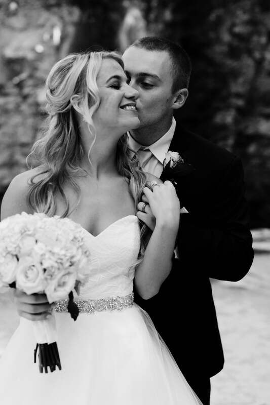 Candid laughter between the bride and groom during golden hour