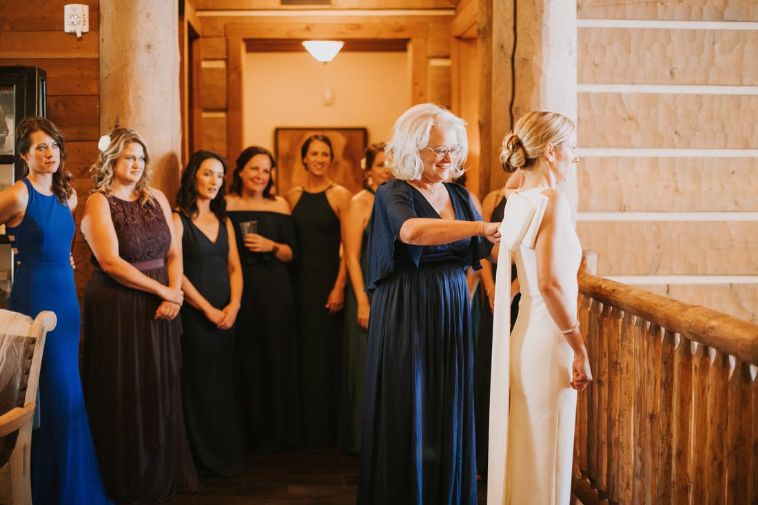 Couple walking hand in hand through the mountain meadow