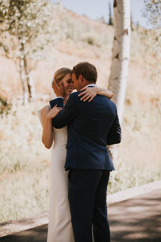 Detail shot of the wedding rings against a mountain backdrop