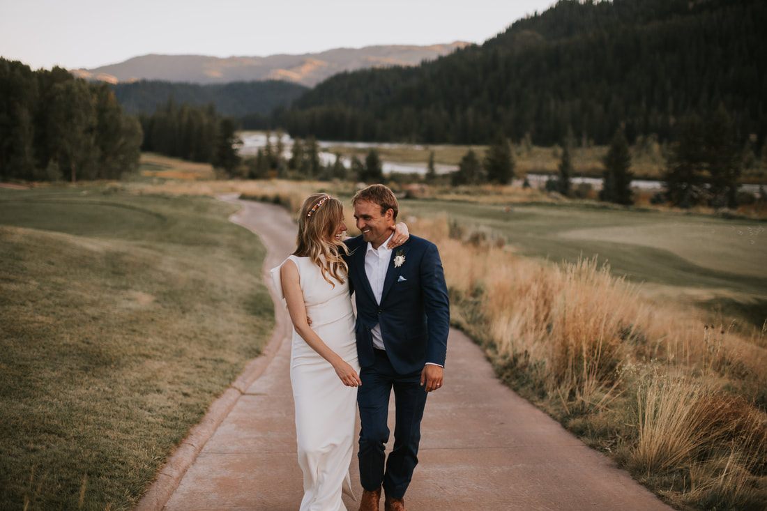 Couple's romantic portrait near a mountain lake
