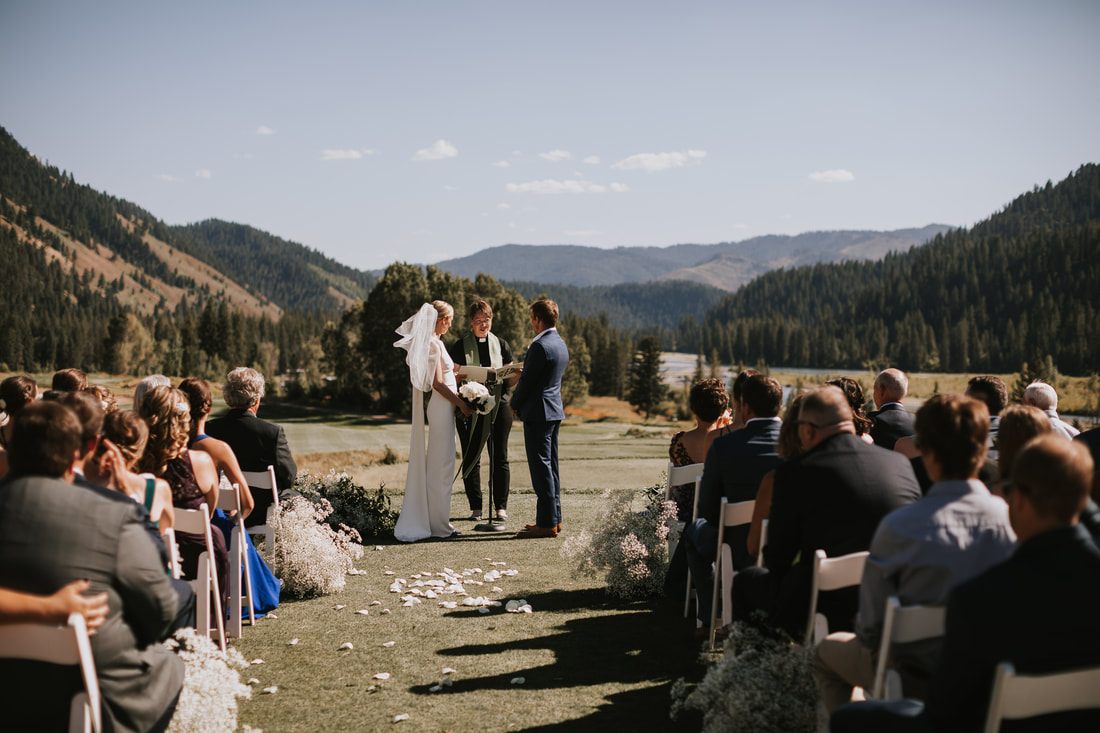 Couple dancing together during their outdoor reception