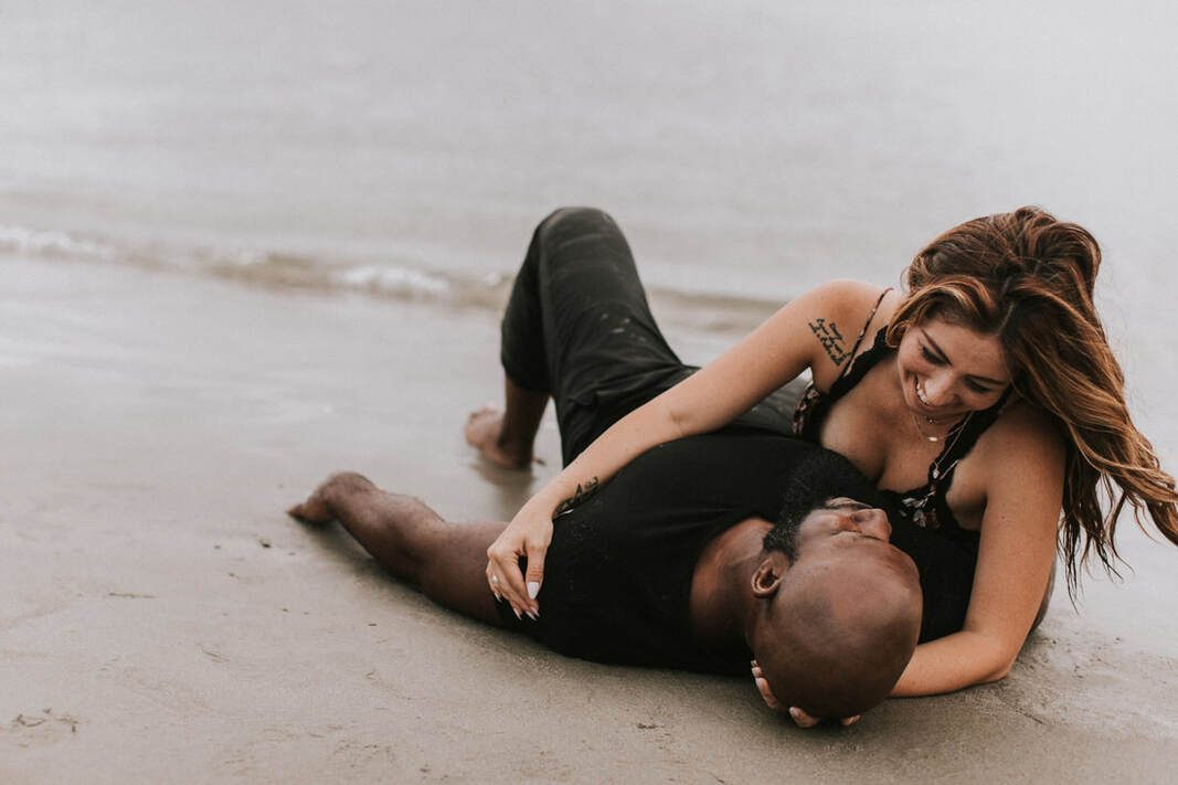 Couple standing close together during a golden-hour engagement session