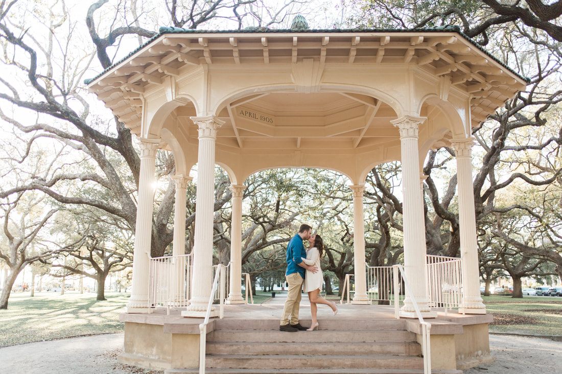 Newlywed couple posing together outdoors after their wedding ceremony