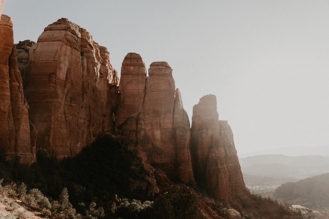 Wide desert view of Sedona's red rock canyons and buttes.