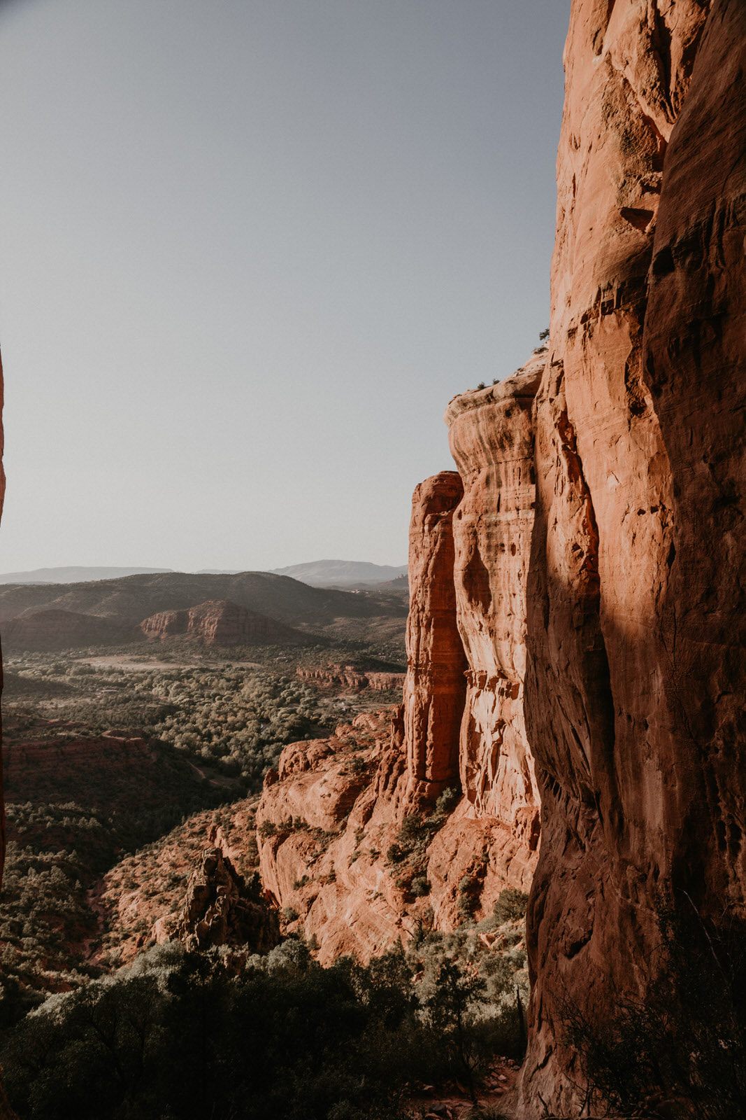 Close-up travel photo of Sedona's layered red rock cliffs.