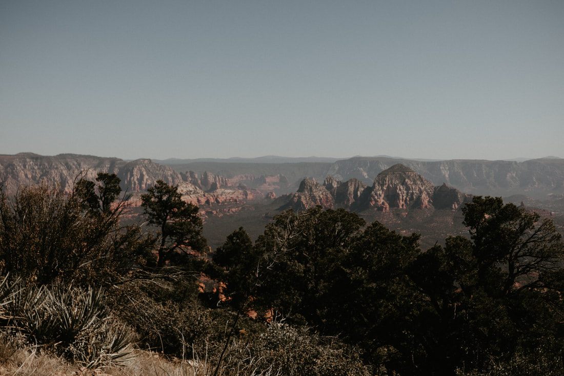 Golden hour light over Sedona's rust-colored rock formations.