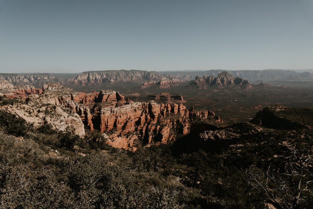 Sedona sunset casting warm light across the desert landscape.