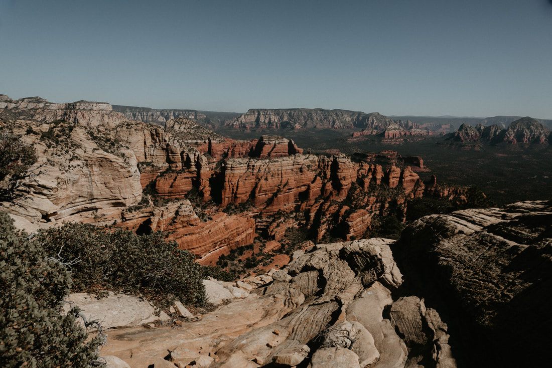 Desert hiking trail winding through Sedona's red rock landscape.