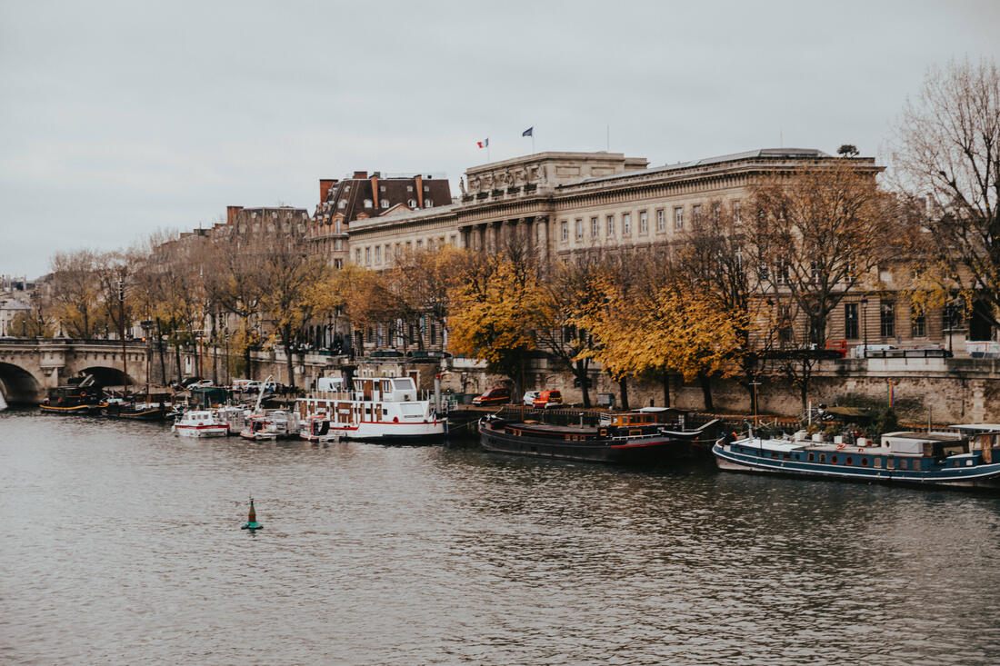Wide view of a Paris square filled with holiday shoppers