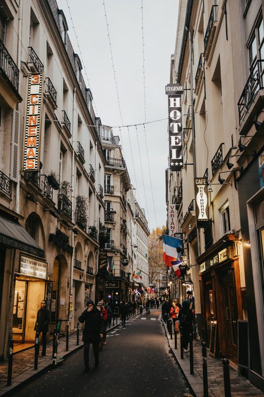 A Parisian storefront strung with holiday lights (another frame from the trip)