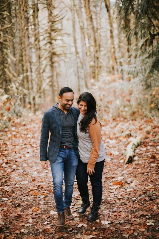 Candid laughter between the couple during their engagement session