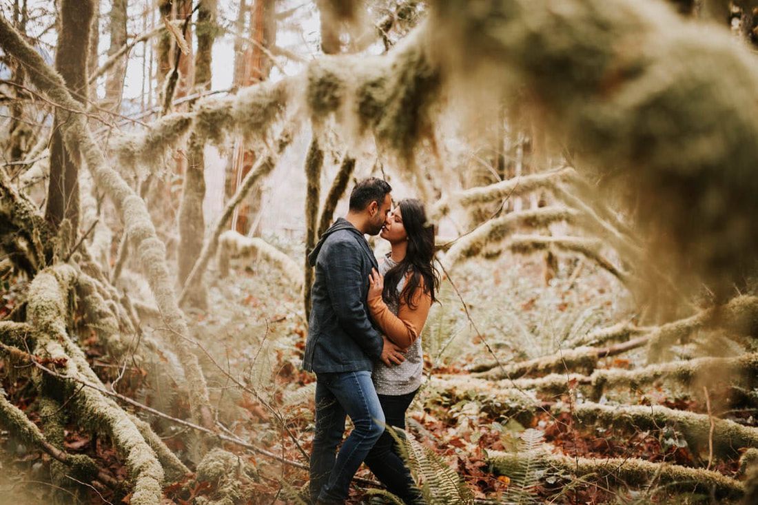 Golden hour engagement portrait in the forest near the cabin