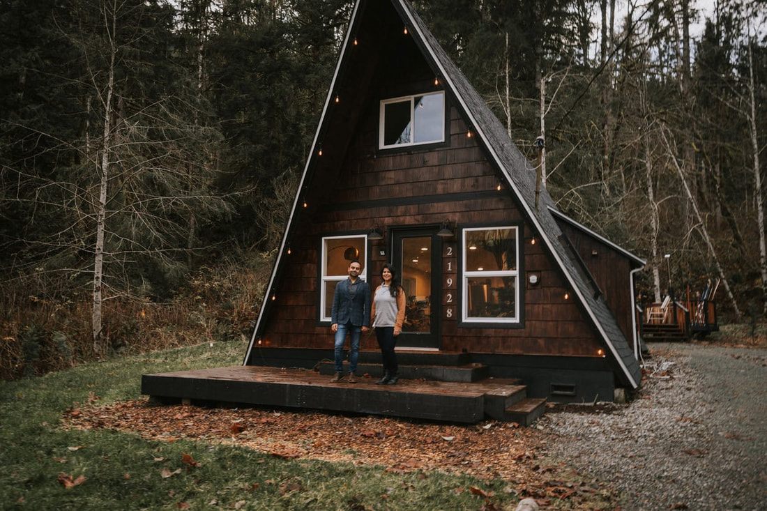 Couple sharing a quiet moment on the cabin's front steps