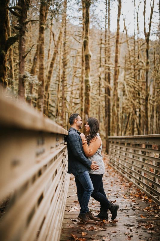 Couple soaking in the cedar wood-fired hot tub at That PNW Cabin