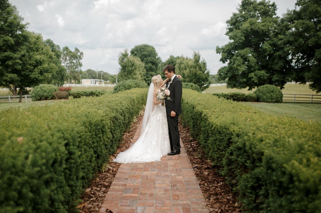 Bride and groom sharing a quiet moment during their Nashville wedding portraits