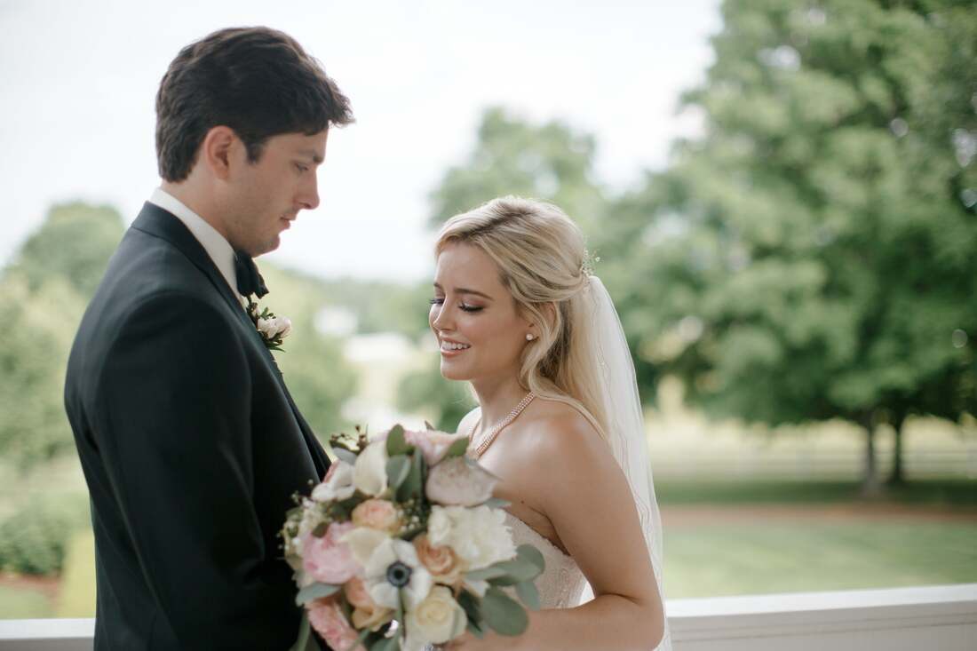 Bride and groom walking hand in hand through downtown Nashville