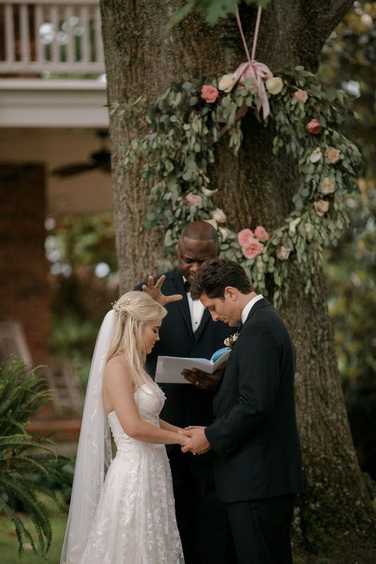 Bride adjusting her veil before the Nashville wedding ceremony