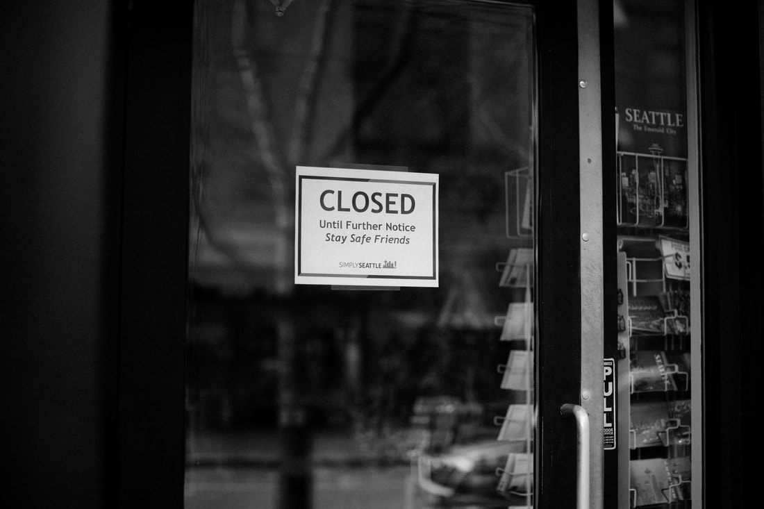 Boarded-up storefront window in downtown Seattle during the coronavirus quarantine.