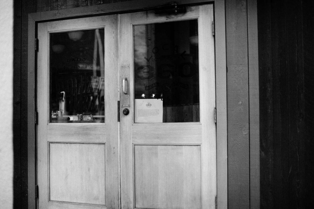Boarded-up storefront window in downtown Seattle during the coronavirus quarantine.